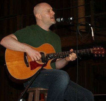 Michael Mulder performing live with acoustic guitar